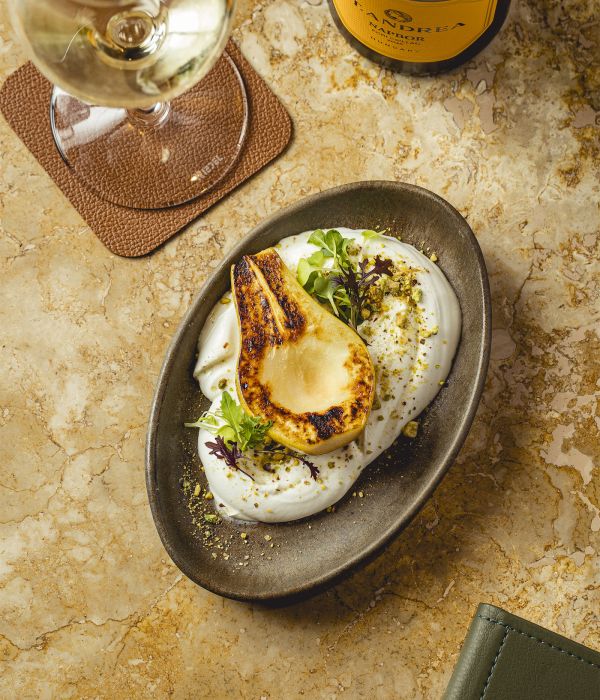 Goat cheese cream with roasted pear, toasted pistachios and toast