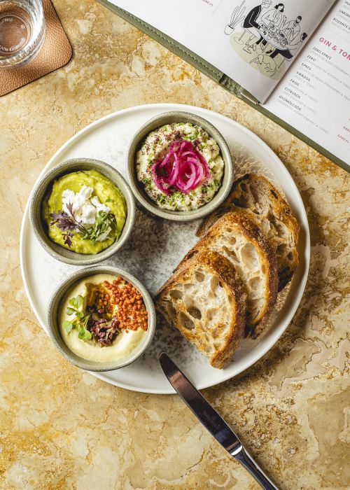 Zazie Dip Selection – eggplant dip, hummus, avocado dip, served with sourdough bread