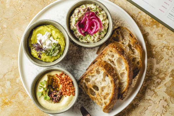 Avocado dip with coriander, feta and toast
